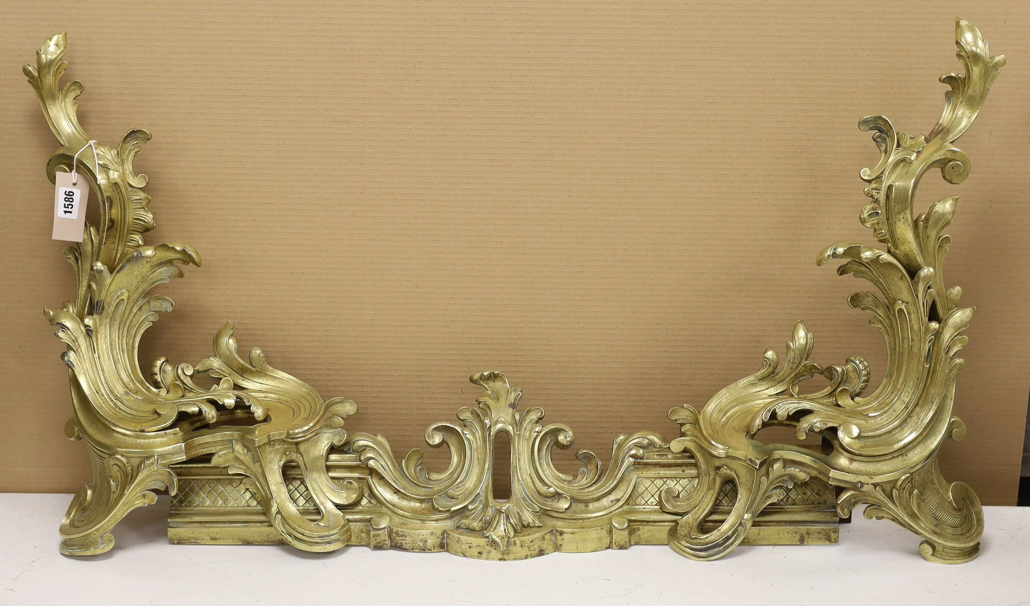 A French rococo style bronze adjustable chenet